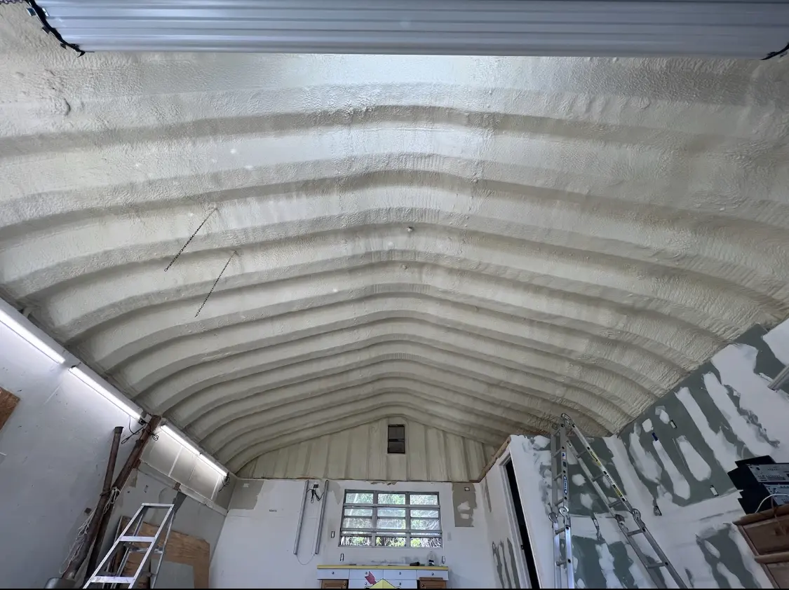 Spray polyurethane foam applied to the underside of a metal roof deck in Coolidge